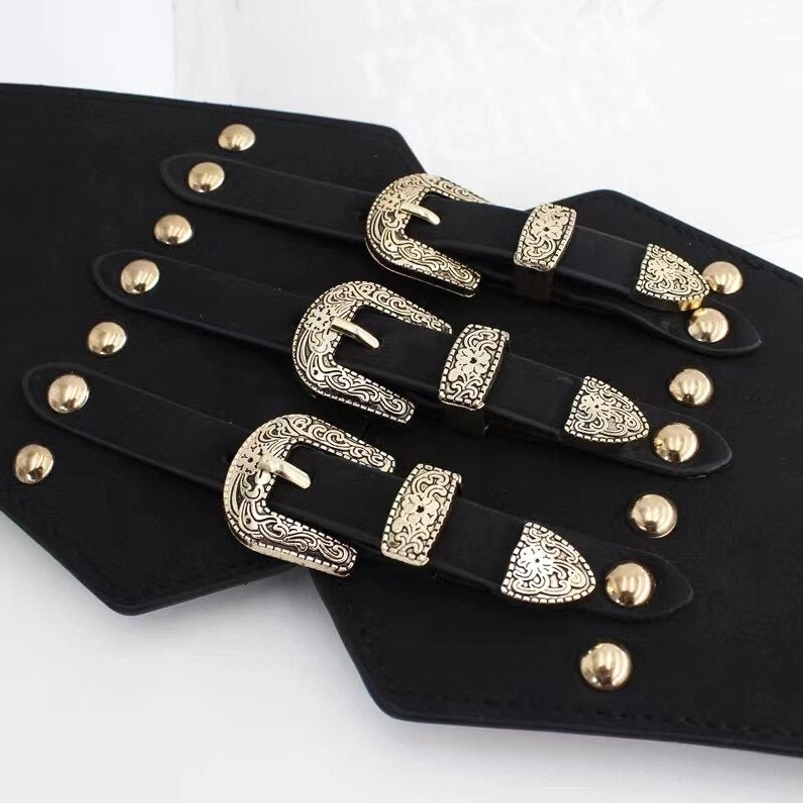 Steampunk corset waist belt flat lay top-down view displaying black PU leather with gold engraved buckles and decorative gold studs