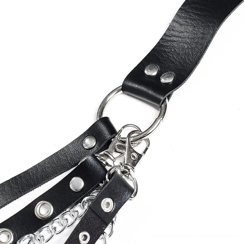 Detailed close-up of steampunk chain belt hardware showing linked silver metal chains, O-shaped rings, and metal rivets attached to black leather bands
