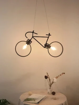 Industrial bicycle steampunk lamp installed in cozy home dining room with warm ambient lighting and Nordic decor