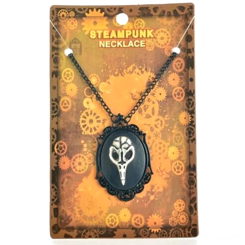 Steampunk bird skull necklace with ornate black metal pendant and chain displayed on retail packaging with industrial gear motif, front view
