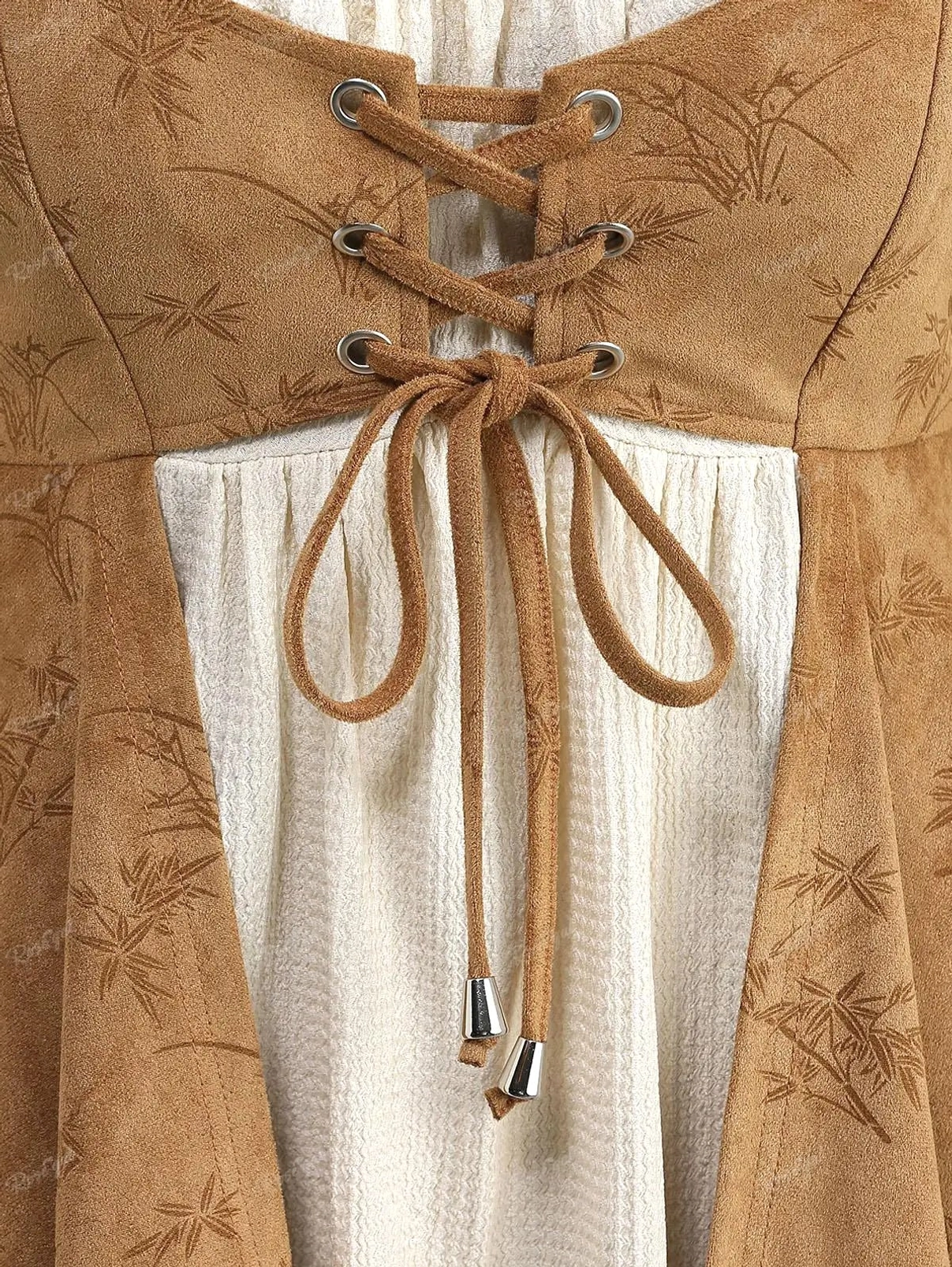 Close-up of steampunk blouse corset front featuring grass embossed brown suede with leather lace-up details