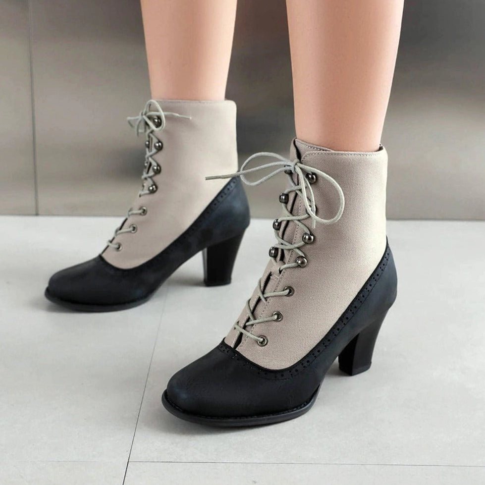 Steampunk Victorian boot side view - off-white canvas with matte black leather panels, light grey laces, metal lace eyelets, 2.8 inch block heel
