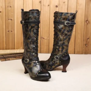 Vintage steampunk boots featuring dual decorative straps, embossed floral pattern, and curved wooden heel - mixed angle view