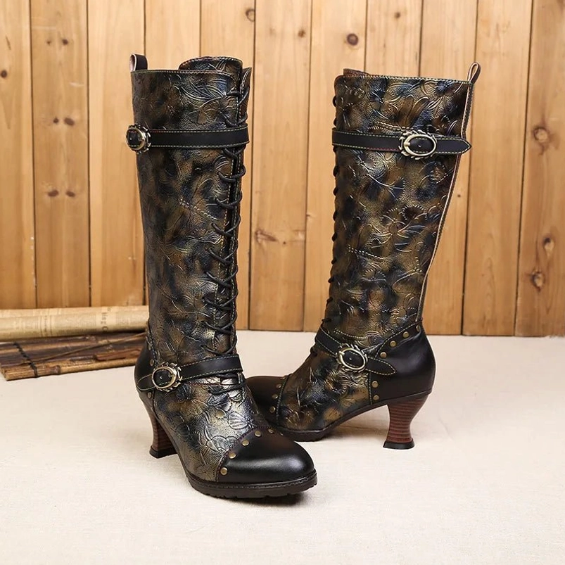 Vintage steampunk boots featuring dual decorative straps, embossed floral pattern, and curved wooden heel - mixed angle view