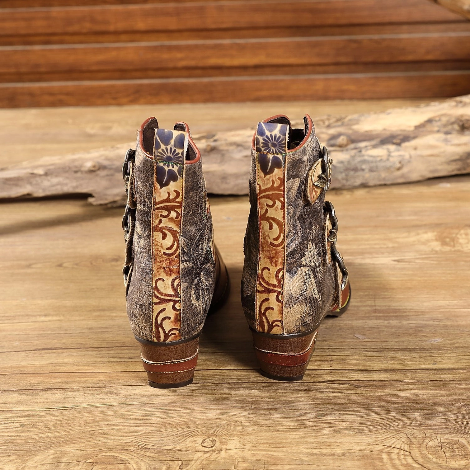 Steampunk boots back view showing embossed floral rear panels and heel pull tabs with decorative details