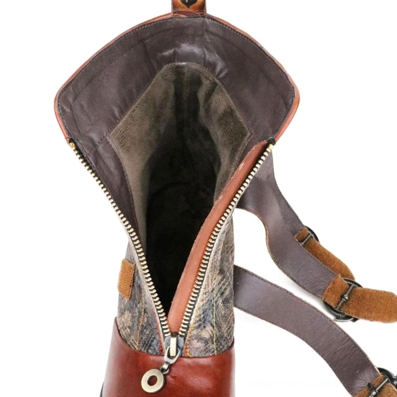 Steampunk boots interior close-up showing dark fabric lining, metal zipper hardware and adjustable strap system
