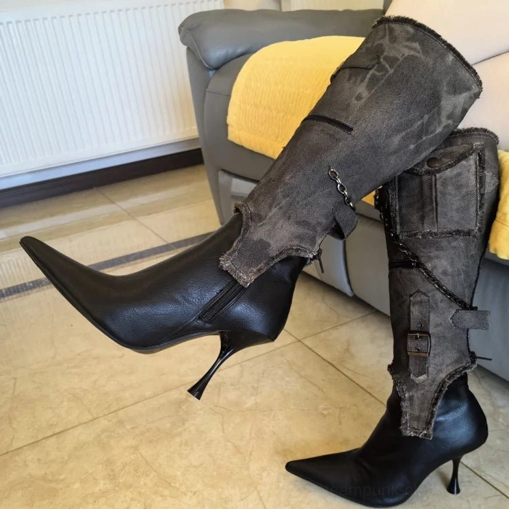 Steampunk mid-calf stiletto boots low side angle worn on model, faded camo-style distressed canvas cuffs with leather base and chain details