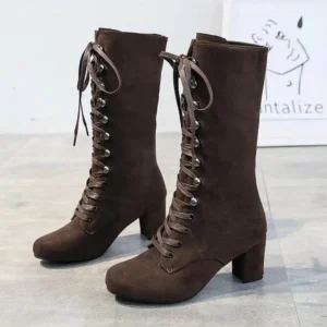 Top-down view of brown steampunk lace-up mid-calf boots showcasing suede texture and lacing detail