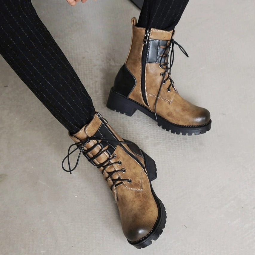 Overhead top-down view of steampunk combat boots pair - integrated side zippers visible on both boots, chunky lug sole pattern, complete two-tone brown and black design