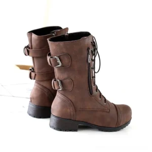 Steampunk women's boots rear angle display, highlighting dual buckle hardware details and dark matte leather finish with low block heel