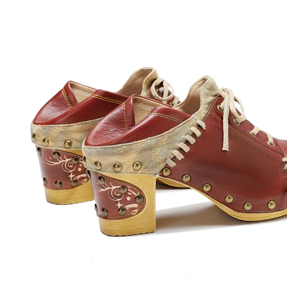 Steampunk lace-up boots rear view showing studded heel accents, canvas vamp panel and leather lacing system