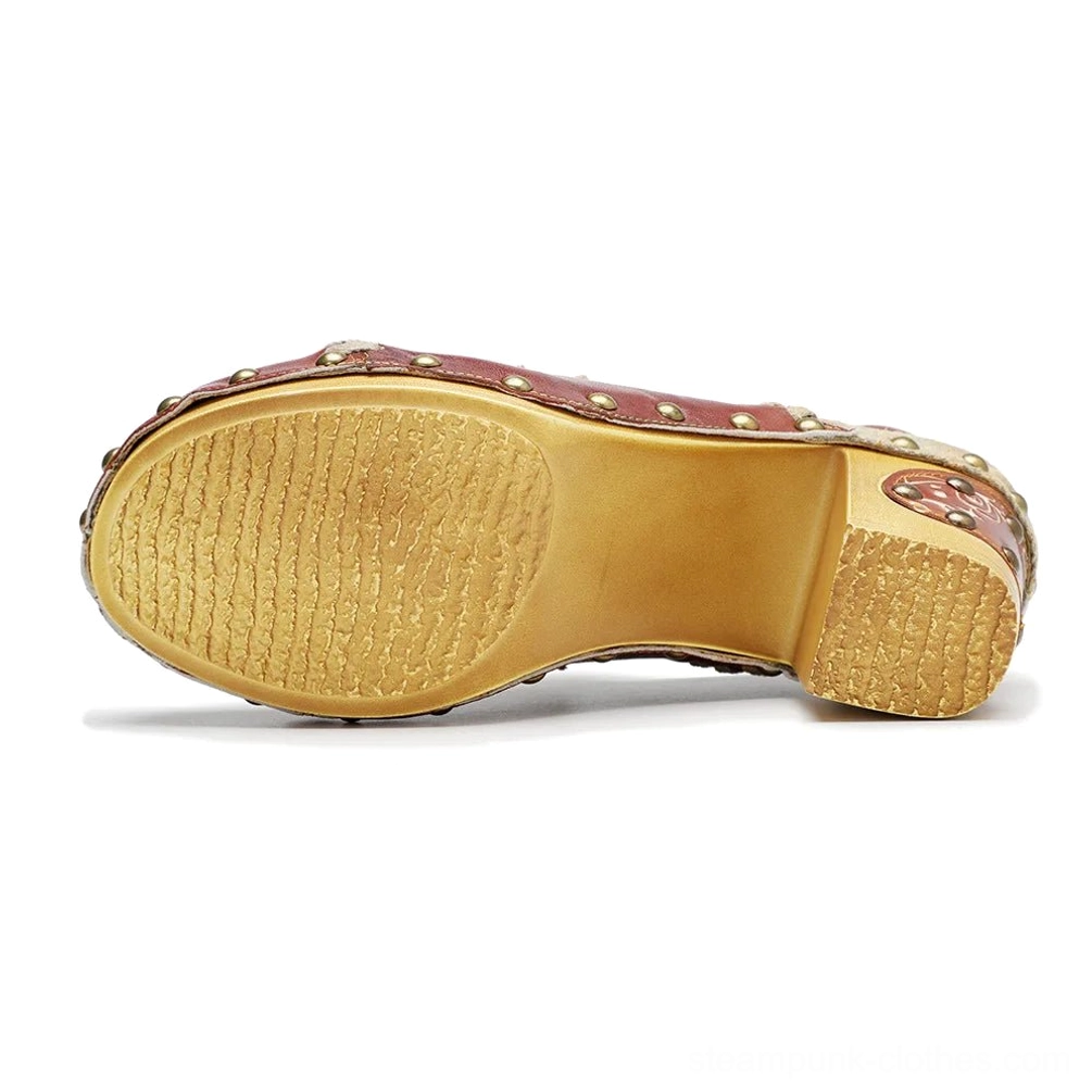 Steampunk leather boots sole view displaying non-slip rubber outsole, wooden block heel and reinforced studded heel cap