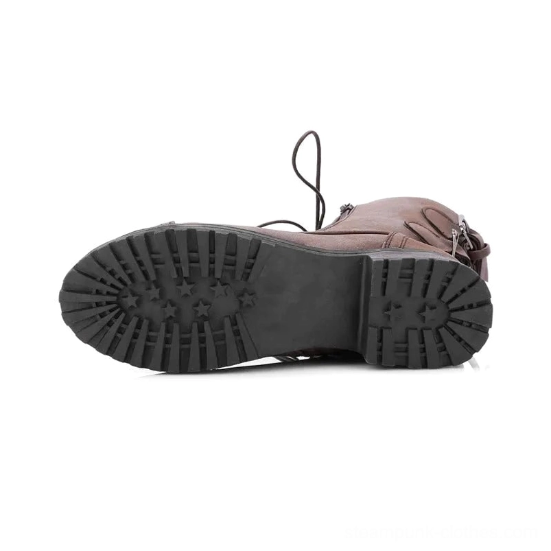 Black rubber lug sole of steampunk combat boots showing distinctive star tread pattern and engineered grip design