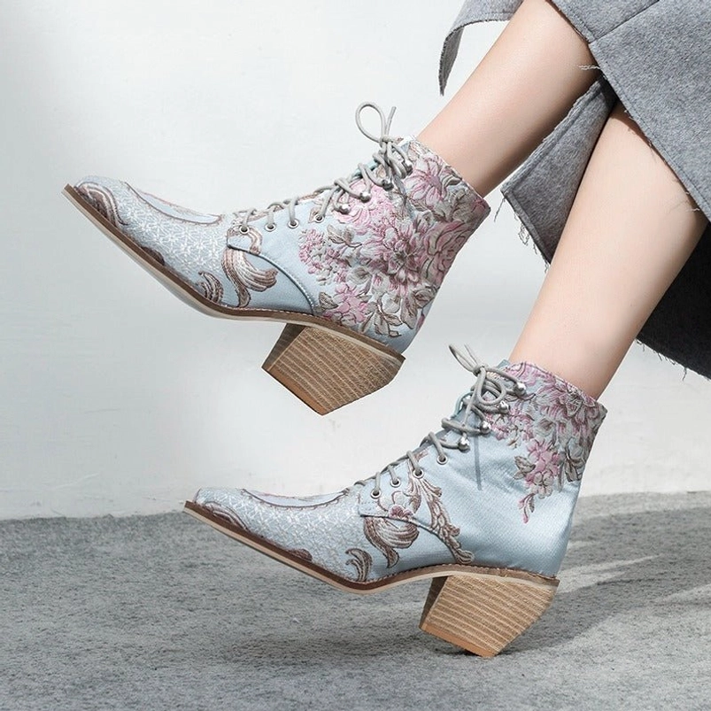 steampunk-ankle-boots-worn-with-gray-outerwear-metal-lace-studs-detailed-floral-embroidery