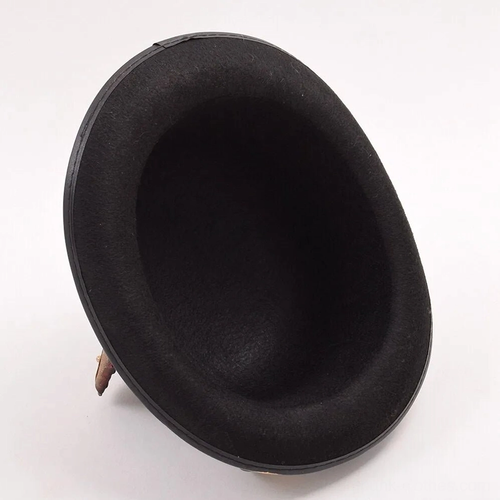 Interior side view of empty steampunk bowler hat showing smooth matte black felt and classic round crown shape