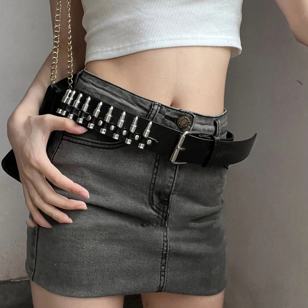Steampunk bullet stud belt worn on midriff, showing silver metal bullet studs in precise rows on black faux leather, side profile close-up highlighting industrial craftsmanship and geometric stud arrangement