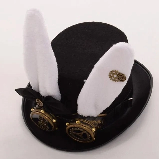 Steampunk bunny ear top hat overhead view displaying brass gear trinkets on plush white ears, goggles positioned on crown, and structured felt base