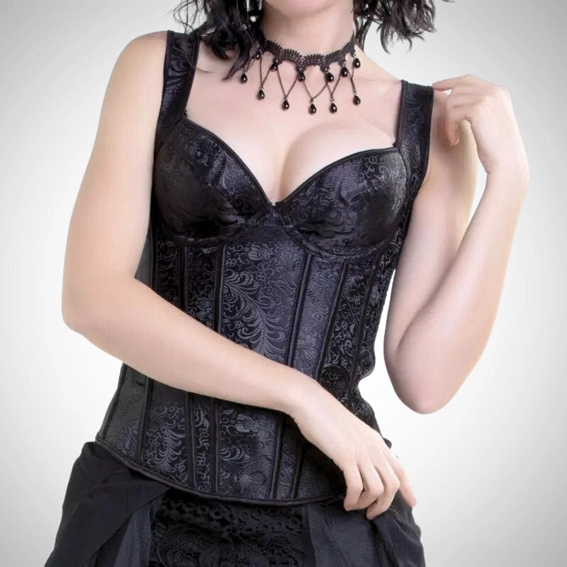 Black steampunk bustier corset with jacquard patterned fabric and padded underwire cups, front half-body view on model