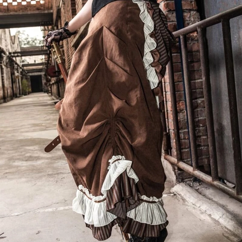 Steampunk bustle skirt back detail showcasing ruched front design with layered white and striped ruffled hem construction, industrial brick wall background