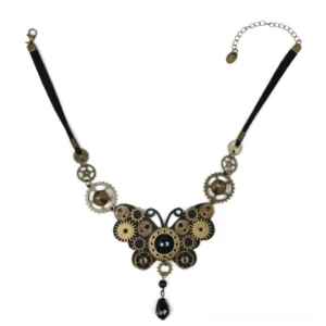 Steampunk butterfly choker necklace flat lay display showing black leather band with vintage brass gears, aged bronze accents, and black teardrop pendant with 10cm extension chain on white background