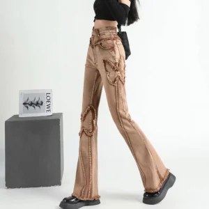 Steampunk butterfly frayed denim pants back view full body shot high-waisted distressed brown jeans with frayed butterfly appliques