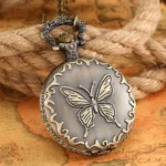 Steampunk butterfly pocket watch with embossed 3D butterfly and ornate scrollwork on cover, bronze tone, displayed on vintage map and hemp rope backdrop