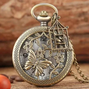 Steampunk butterfly hollow pocket watch front view with intricate floral and butterfly carved design in bronze finish, displayed on vintage wooden table with coffee accessories