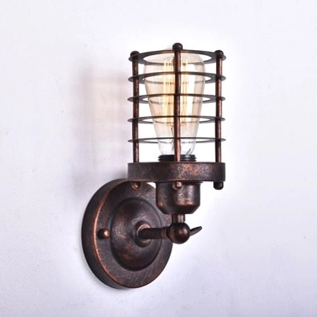 Steampunk cage wall lamp left side view with rustic bronze metal finish and horizontal metal guard frame on white wall