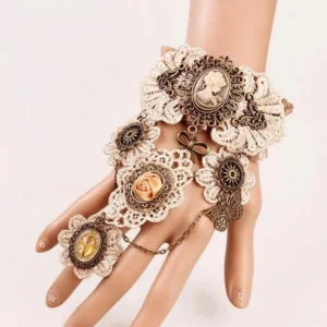 Steampunk cameo gloves with antique bronze hardware and beige crochet lace, front view on mannequin hand showing carved cameo portrait and flower charms with linked finger chain ring