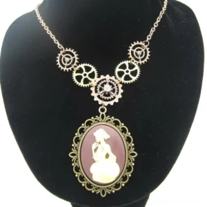Steampunk cameo necklace worn on black velvet jewelry mannequin display showing full length and drape of rose gold chain