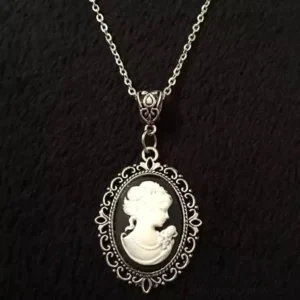 Full steampunk cameo necklace showcasing complete pendant design with black-and-white Victorian lady cameo in ornate metal setting, front flat view on dark background