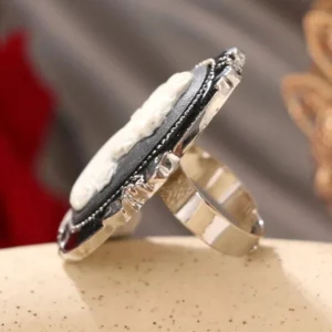 Gothic cameo statement ring side view - showing polished silver band and textured ornate edging detail