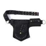 Black steampunk canvas hip bag with lace-up pocket details and antique brass grommets, flat lay top view studio photography