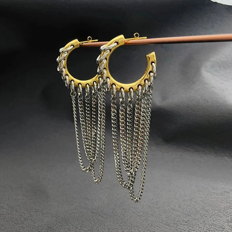Hanging steampunk chain tassel hoop earrings displaying dual-tone metal finish and dense chain tassels on wooden display