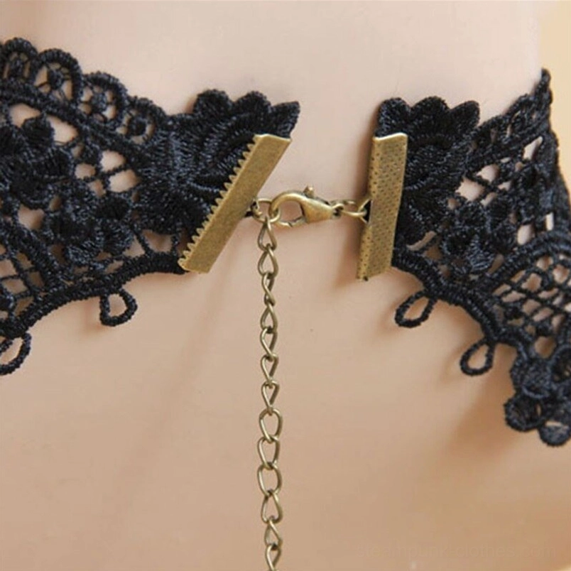 Steampunk choker clasp detail showing black lace texture, gold metal adjustable closure, and extension chain mechanism - close-up side profile