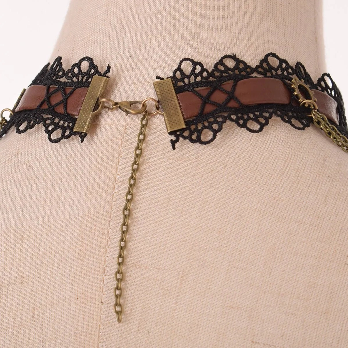 Back view of steampunk wing choker showing adjustable extension chain and bronze metal hardware