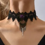 Black lace gothic steampunk choker worn on female model from front, featuring purple rose centerpiece and silver spike pendants against neutral background