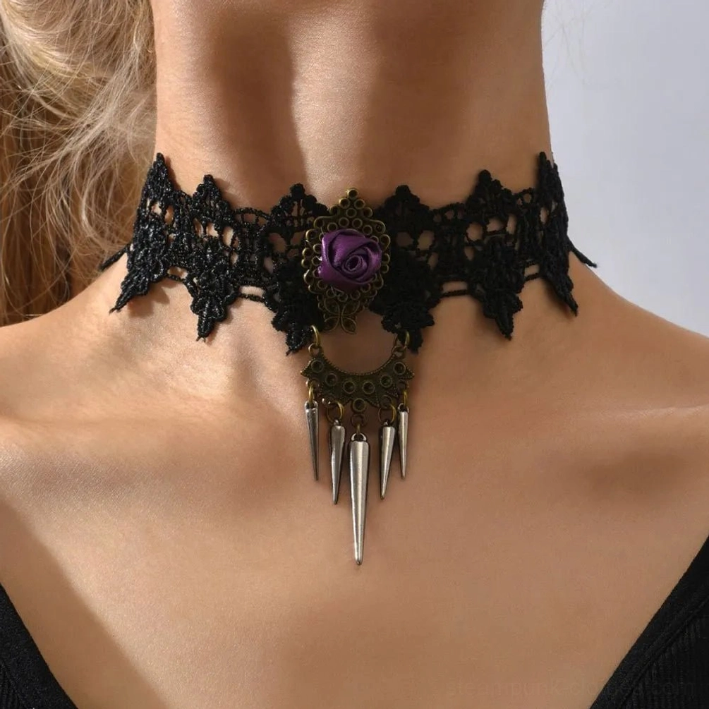 Black lace gothic steampunk choker worn on female model from front, featuring purple rose centerpiece and silver spike pendants against neutral background