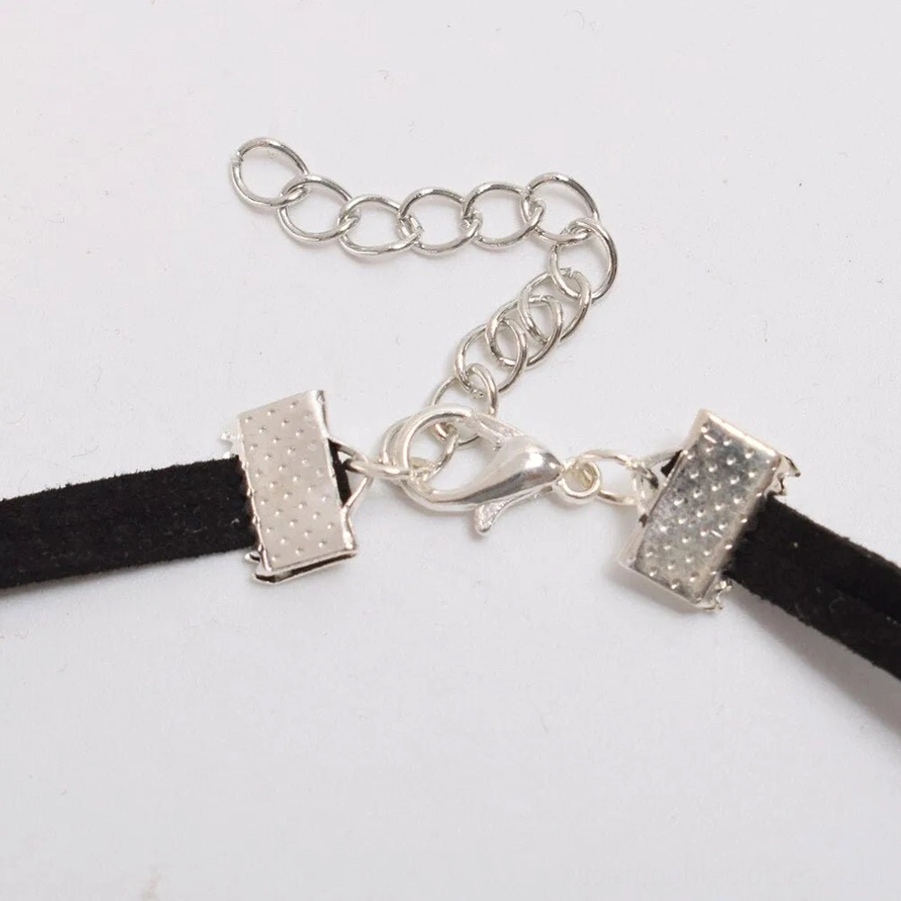 Steampunk choker fastening assembly featuring silver-toned lobster clasp, extension chain, and textured metal hardware - clasp detail