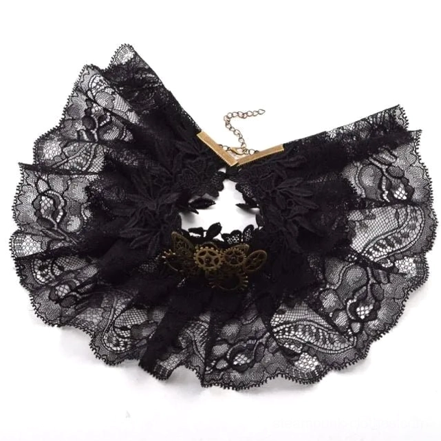 Flat lay overhead view of unworn steampunk choker necklace showing adjustable chain clasp and ruffled lace design