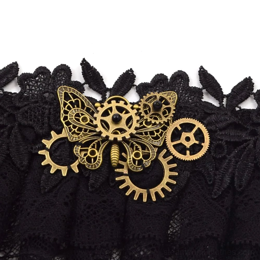 Close-up detail shot of steampunk choker ornament with brass butterfly gear and multiple brass gear pieces on black lace base