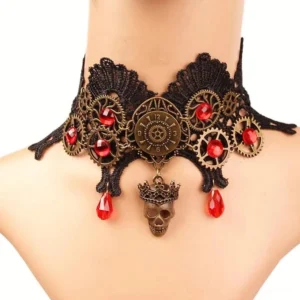 Steampunk black lace choker worn on female mannequin neck displaying front view with bronze ornaments and dangling red teardrop crystals