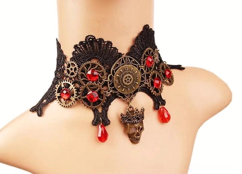 Side front close-up view of steampunk lace choker on female mannequin shoulder displaying black lace, bronze gear details, red crystals, and skull pendant