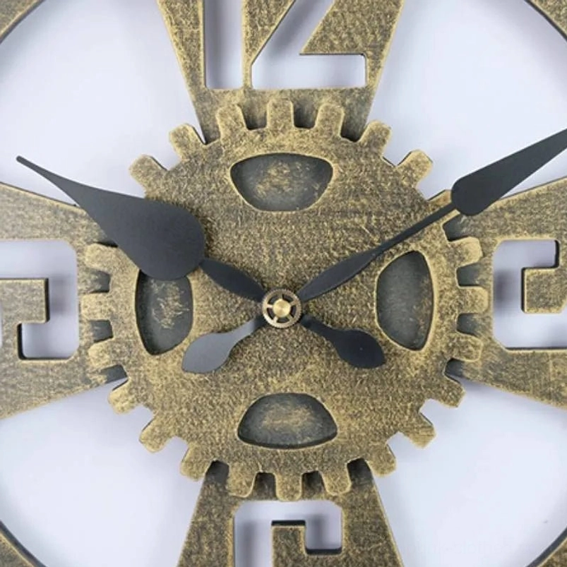 Close-up macro detail of steampunk gear clock featuring aged bronze gear textures and black clock hands on white background