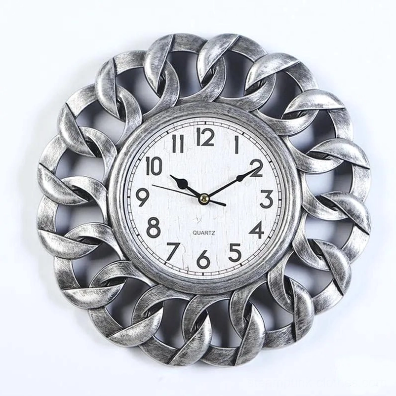 Brushed silver steampunk floral wall clock with weathered white clock face and intertwined metal frame design