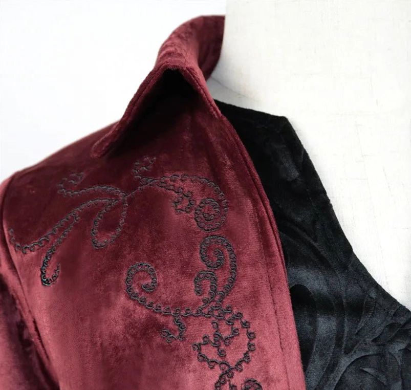 Steampunk coat collar close-up detail - black scroll embroidery on velvet with notched lapel and embossed inner fabric texture