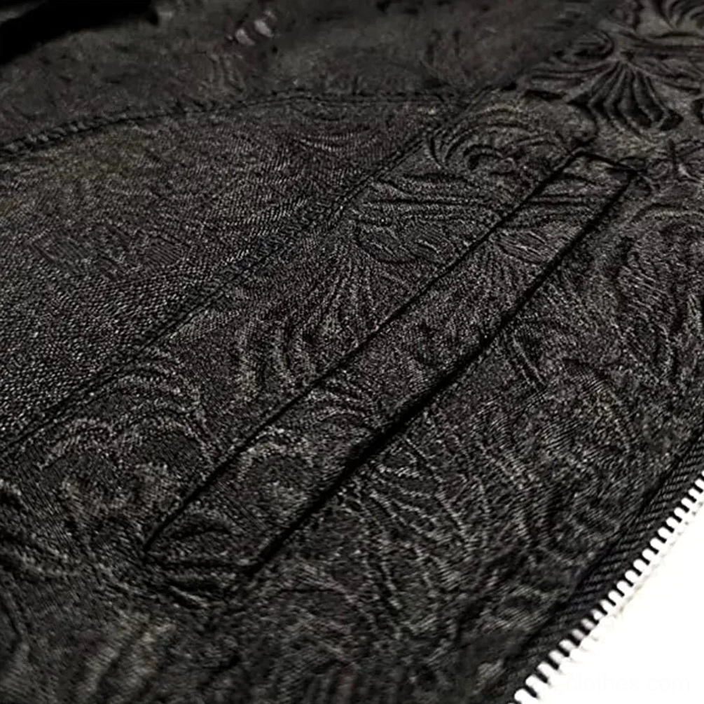 Close-up macro detail of steampunk coat black floral jacquard fabric texture with precision stitching and zipper edge