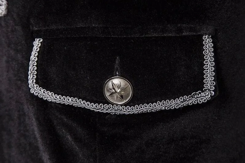 Steampunk coat pocket close-up showing black velvet with silver braid border and star metal button