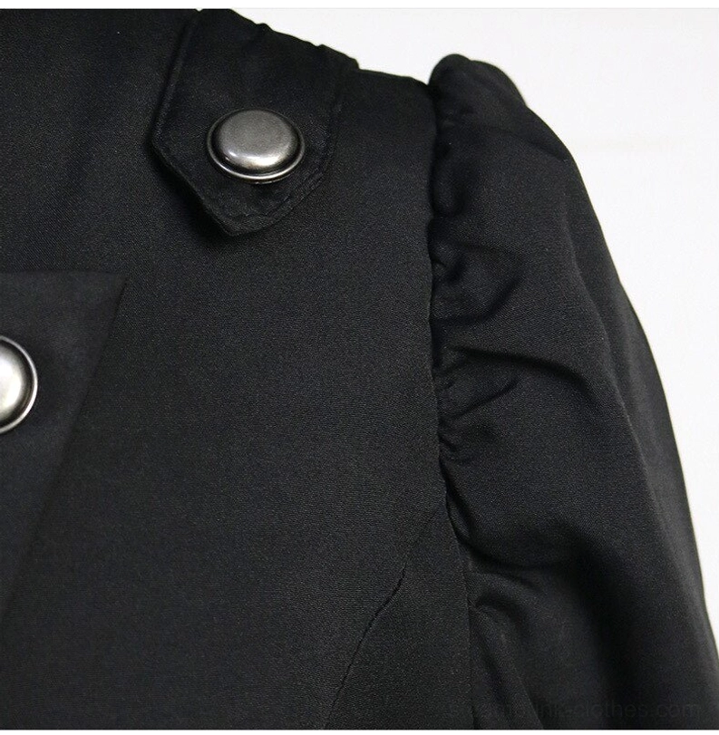 Steampunk coat shoulder detail showing ruffled puff sleeve and metal button strap accent