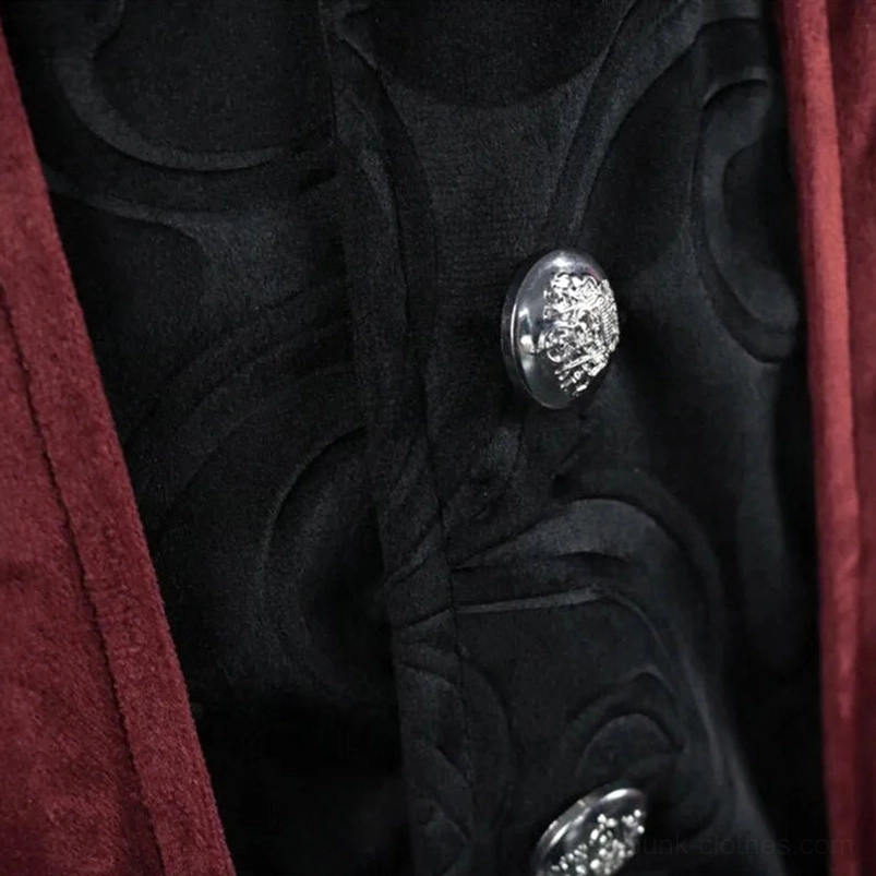 Steampunk tailcoat silver skull-carved button detail - ornate button on black embossed velvet inner layer showing Victorian gothic design and contrast textures